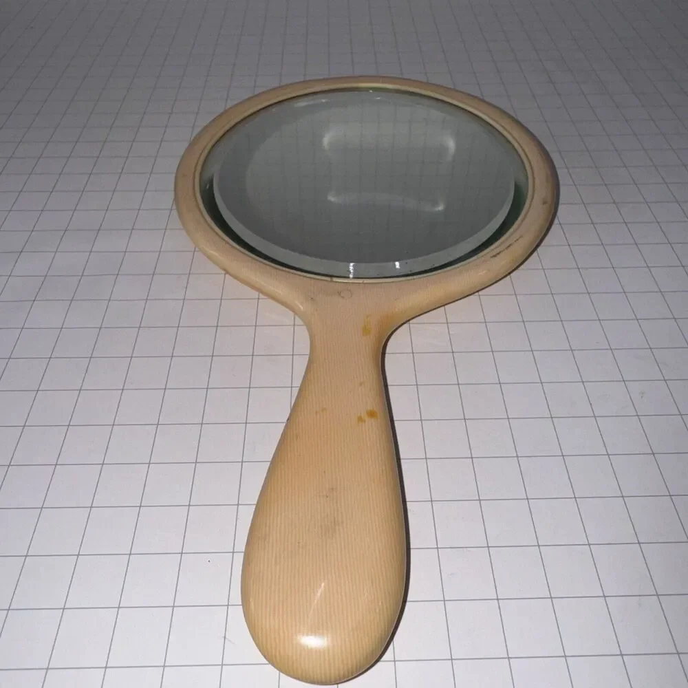 Vintage Art Deco Beveled Oval Celluloid Hand Mirror 9.5” approx Ivory Yellow